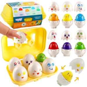 Igrača jajca z obrazi v rumeni škatli